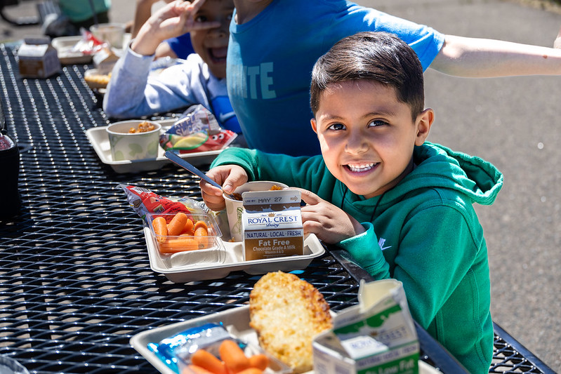 Student eats food during lunch.