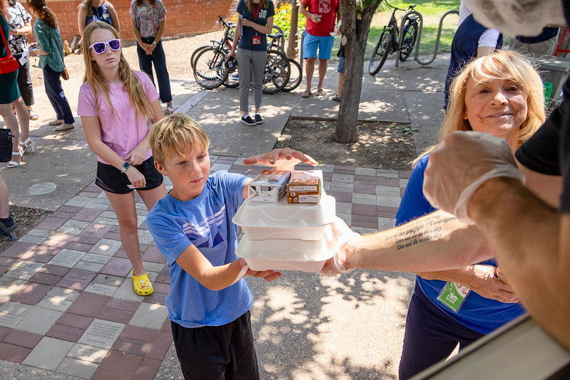 A student receives a meal at a summer lunch site in Loveland last summer. 