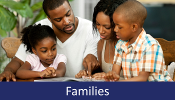 Family of four reading together