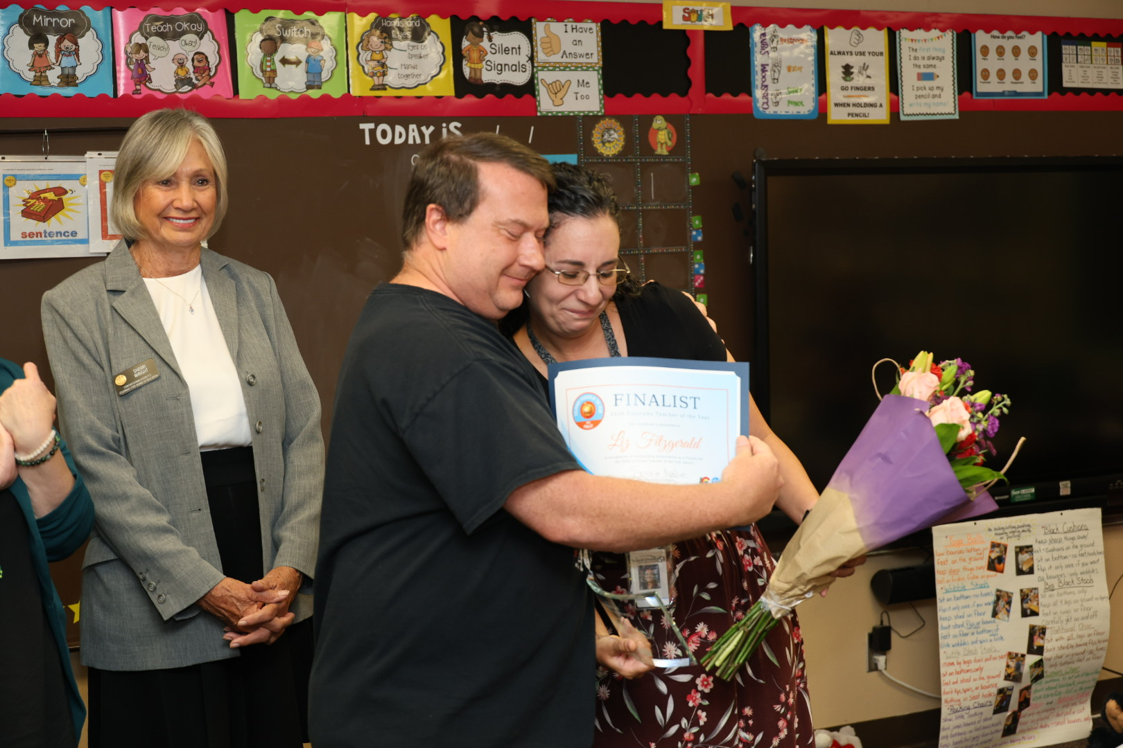 Liz Fitzgerald, a first-grade teacher from Mesa View Elementary in Grand Junction, gets hugs from her students after being named a finalist for the 2026 Colorado Teacher of the Year. 