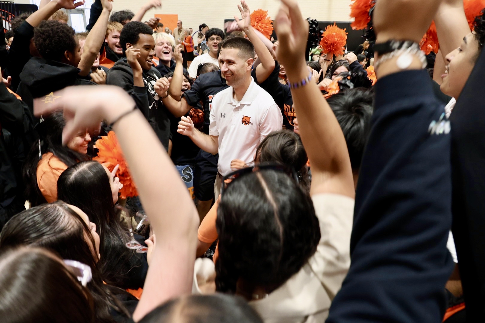 Photo of Stephen Paulson and students cheering